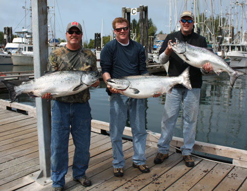 3 men with salmon fish