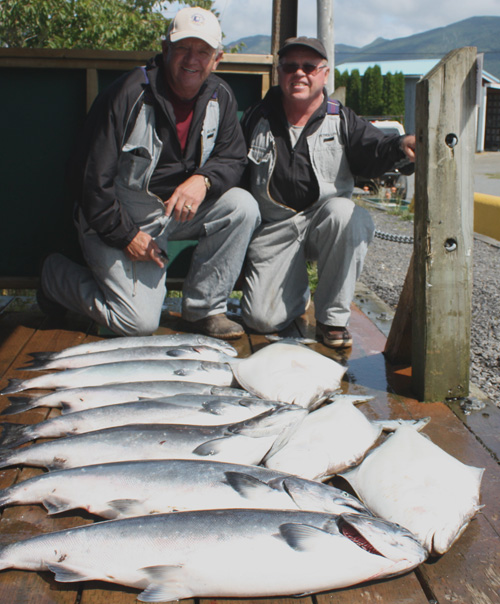 2 man and salmon fish