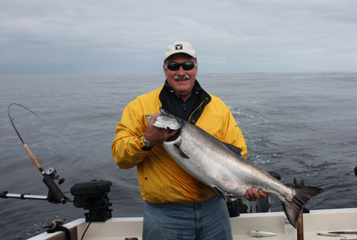 man with salmon fish